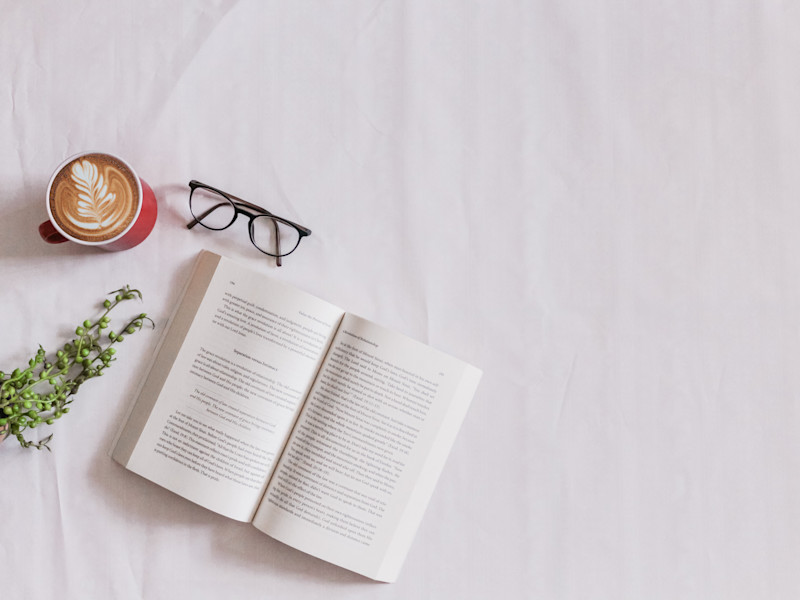Book with coffee and glasses