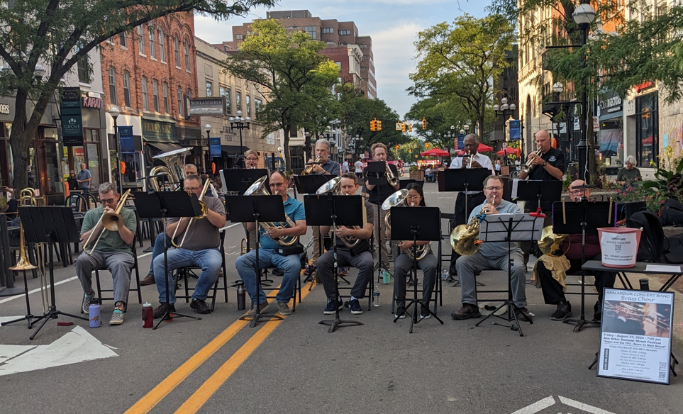 The A2CB Brass Choir performing on Main Street, August 2024