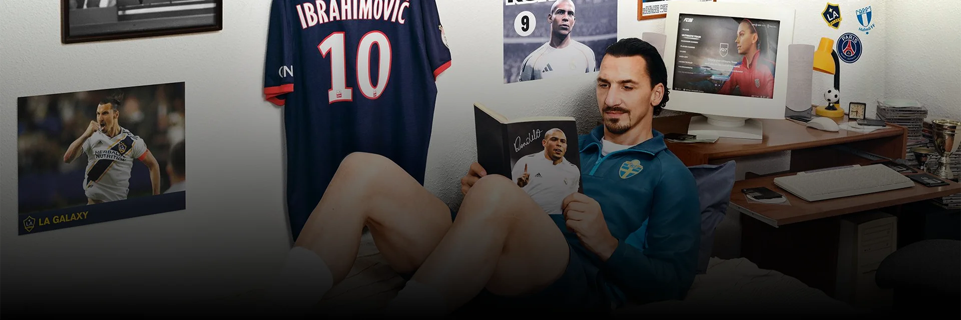 Zlatan Ibrahimović is reading a book in bed, surrounded by memorabilia. Labels for FC 26 & Ultimate Edition are displayed.