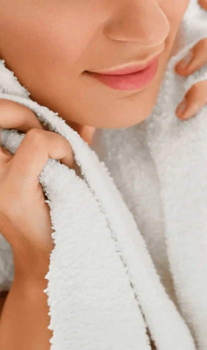 Woman wearing a soft towel around her neck
