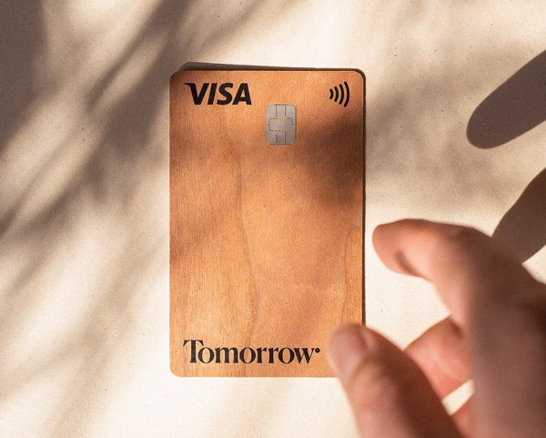 A hand reaching for the Tomorrow Wood card