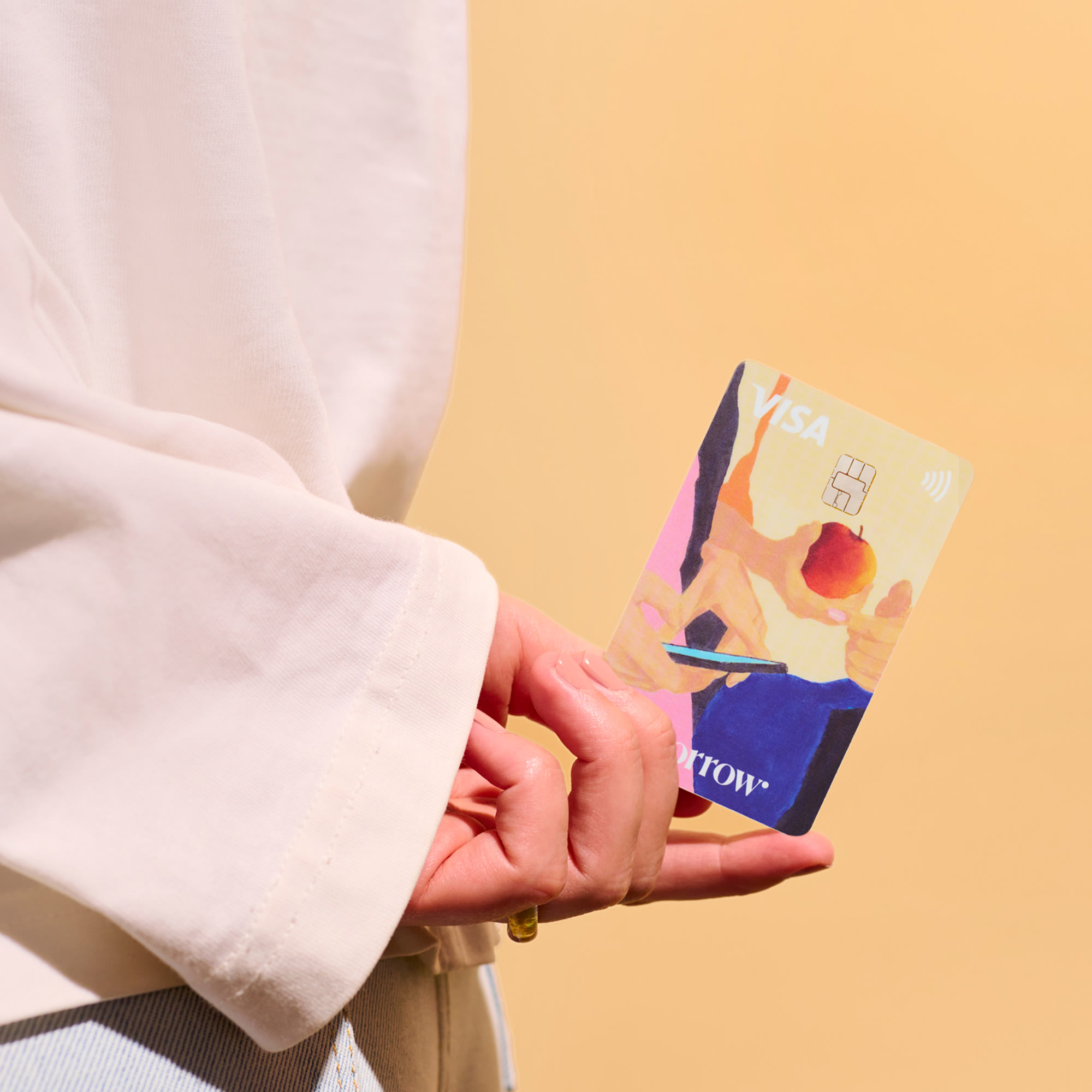 Im Vordergrund hält eine Hand die Karte „Morgen“ mit dem Text „Preis frei wählen“.