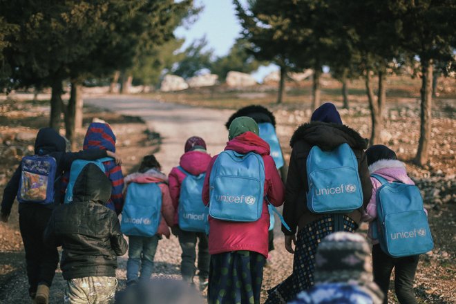 Photo of children with backpacks