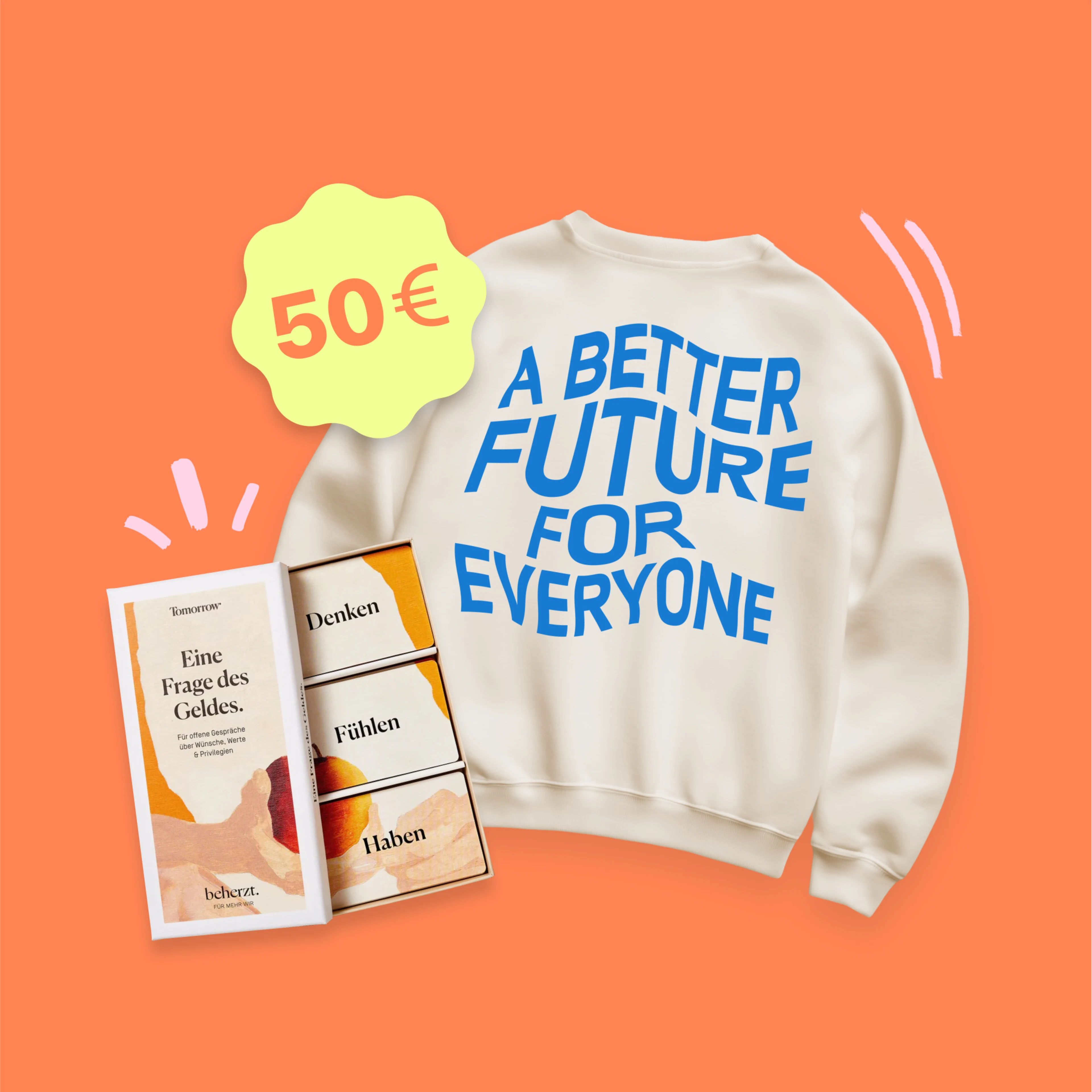 Zwei der im Tomorrow Shop verkauften Produkte, ein Sweatshirt mit der Aufschrift „Eine bessere Zukunft für alle“ und das Tomorrow-Kartenspiel.