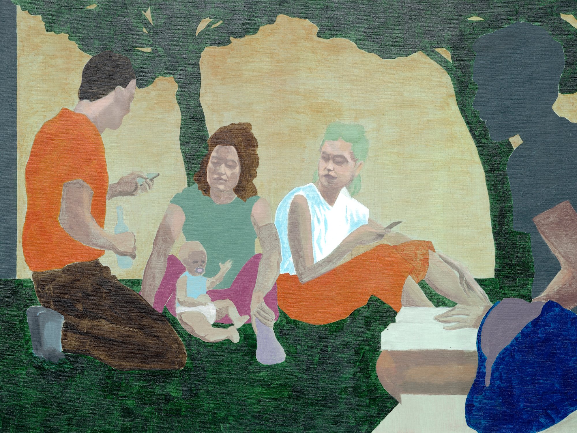 A group of people is sitting in the park chatting