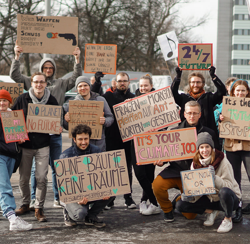 Tomorrow co-workers with posters at Fridays for Future demonstration