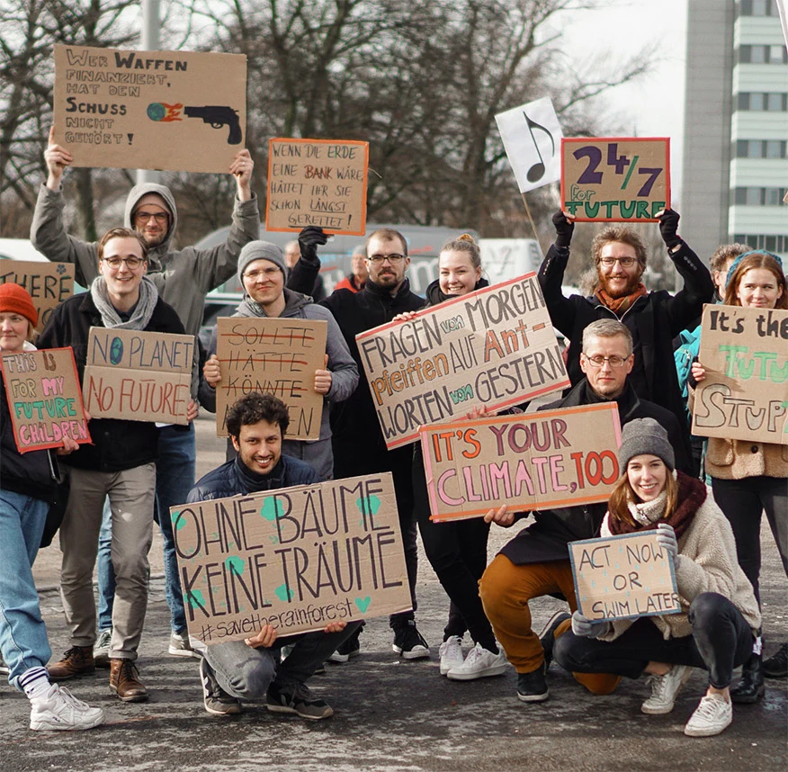 Tomorrow co-workers with posters at Fridays for Future demonstration