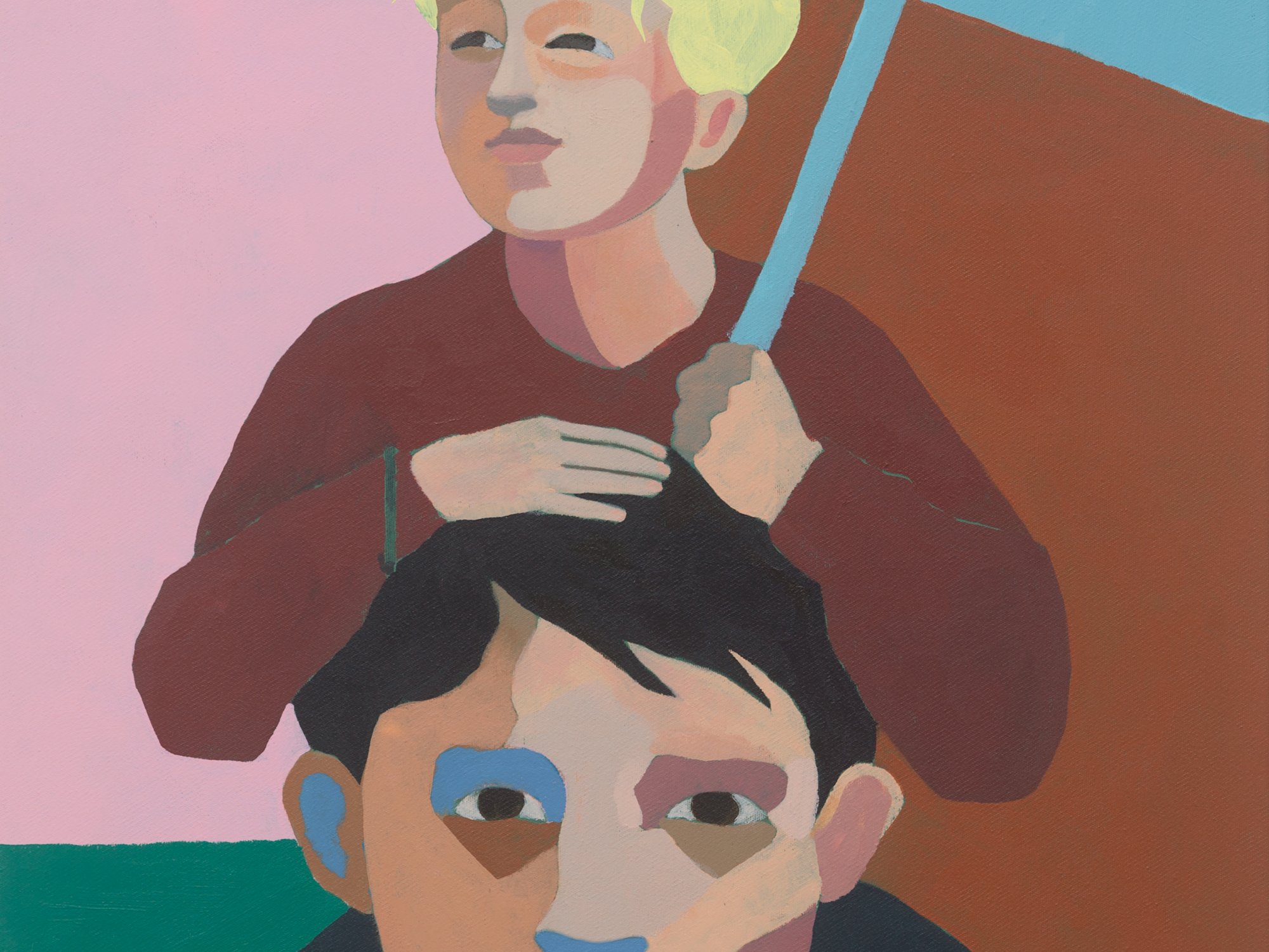 A child with a blue sign is sitting on a mans shoulders