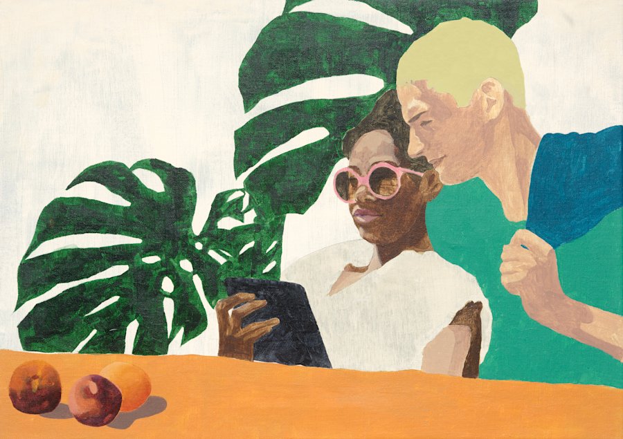 A man is looking over the shoulder of a woman who's holding a tablet