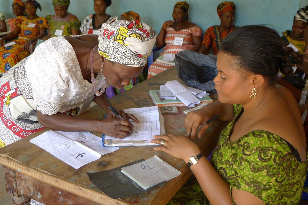 Women sit in a classroom and work together. 