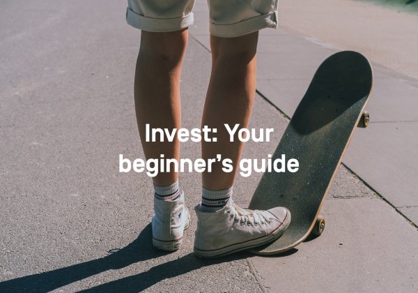 A young man in shorts and Chucks stands on the street. His right foot is on the back of a skateboard, the front wheels are in the air. 
Text: Invest: Your beginner's Guide