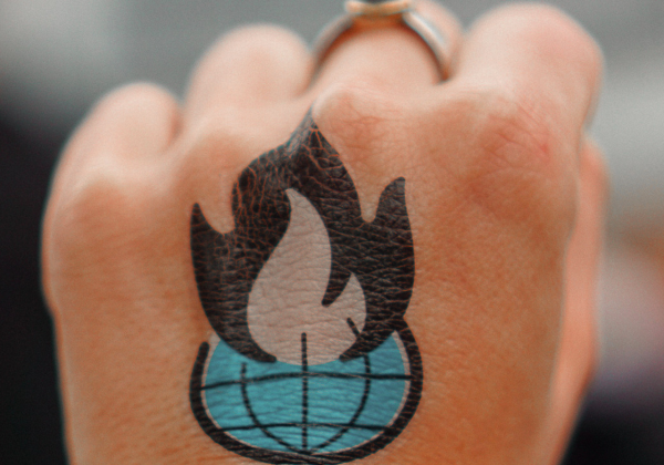 Fist with flame tattoo