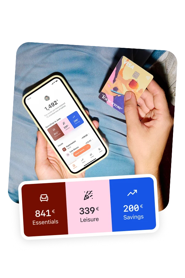 A person holding a smartphone with the Tomorrow app open in their left hand and the Tomorrow card in their right hand.