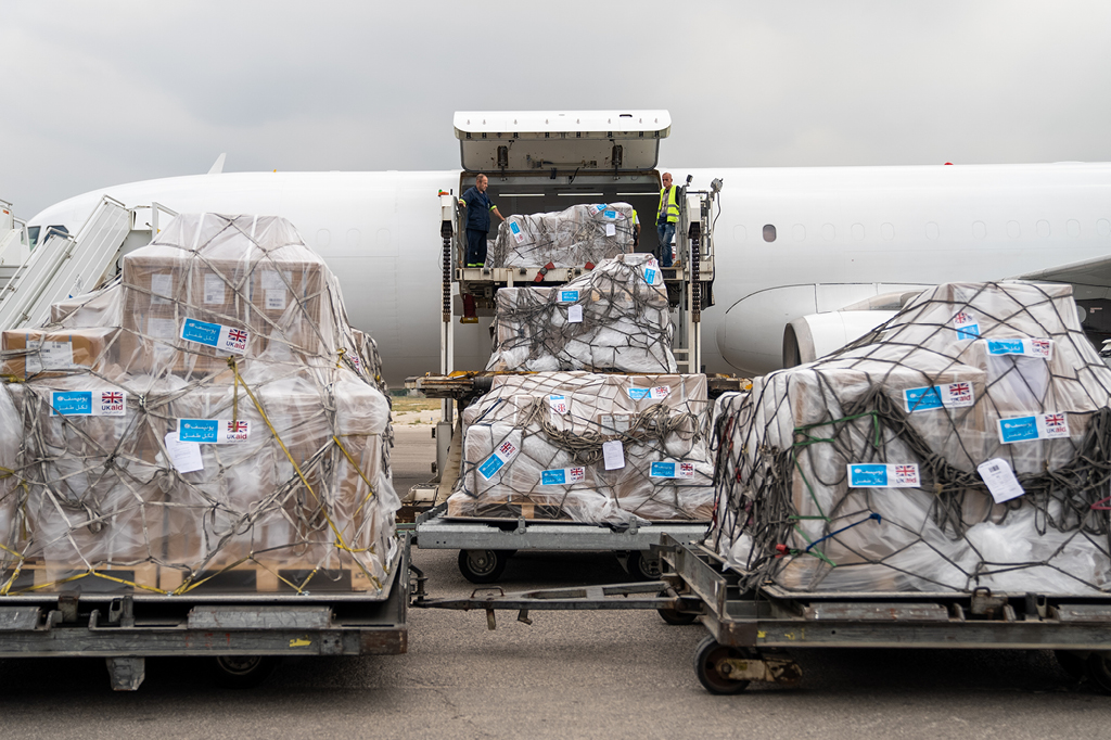 You can see how the aid packages are loaded onto an airplane