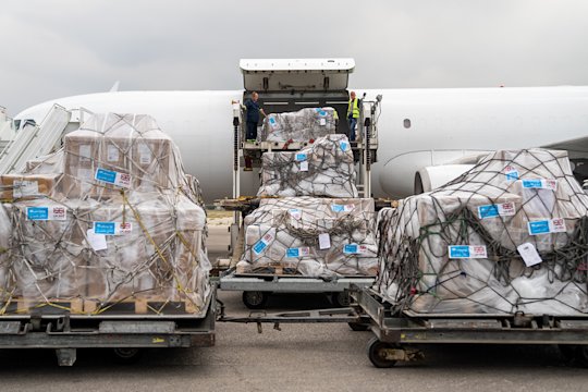 You can see how the aid packages are loaded onto an airplane