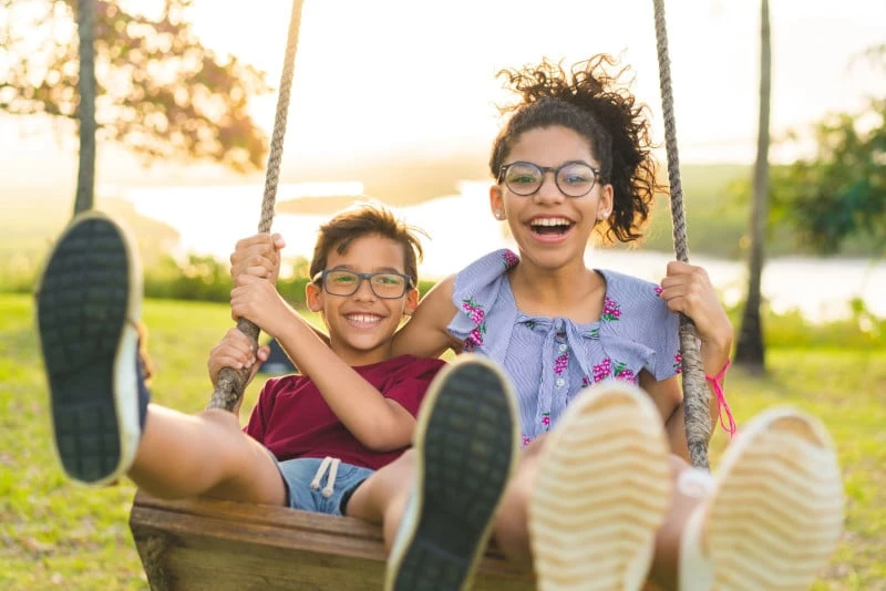 Two children on a swing