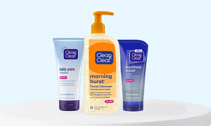 Clean & Clear® packaging of Daily Pore Cleanser, Morning Burst® Facial Cleanser, and Blackhead Eraser® scrub.