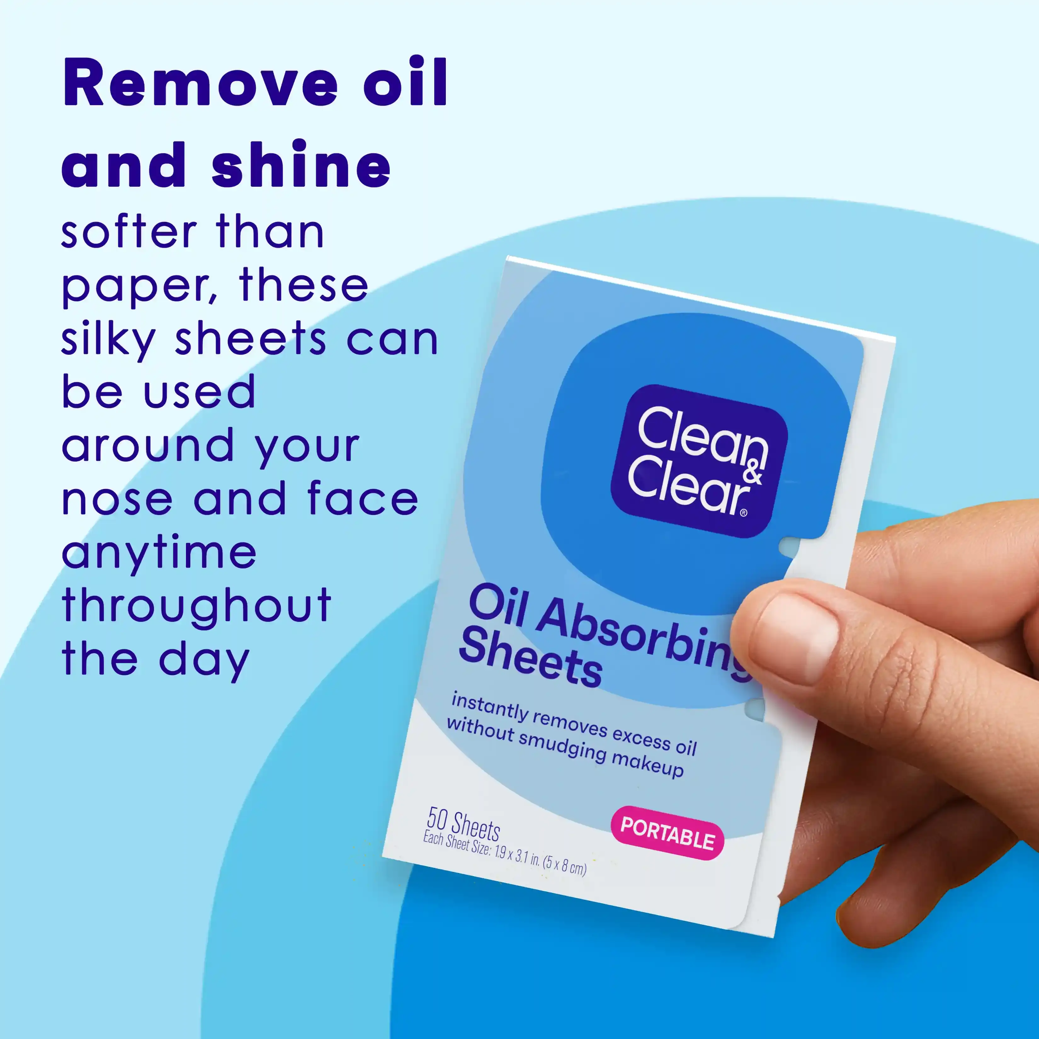 Hand holding Clean & Clear® Oil Absorbing Sheets, silky portable sheets for face throughout the day