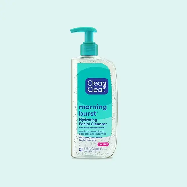 A pump bottle labeled "Clean & Clear morning burst Hydrating Facial Cleanser" with naturally-derived beads, BHA, cucumber, and aloe extracts, stands against a light blue background. Text: "Oil Free" and "8 FL OZ (240 mL)."