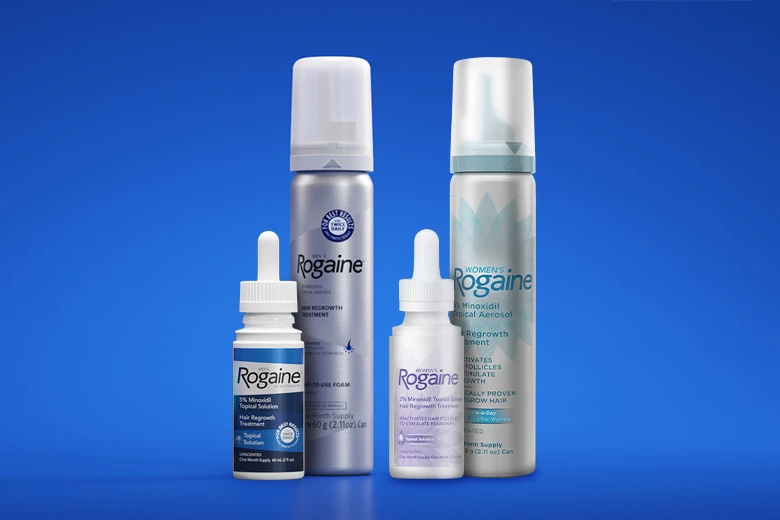 Bottles of Men and Women's Rogaine Foam and Solution on a blue background