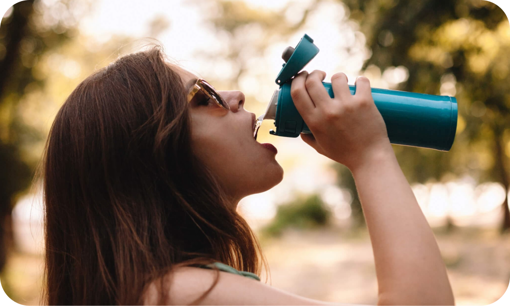 Woman drinking water from a water bottle