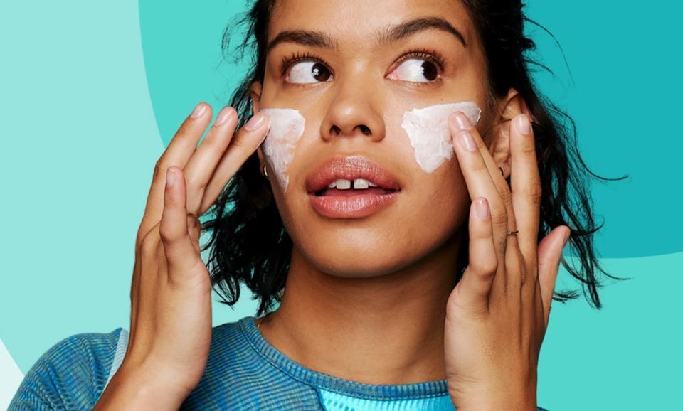 Article banner for the 'Contact Us' page on our site, featuring a cool young woman applying a Clean & Clear product to her cheeks, reflecting a fresh and confident approach to skincare.