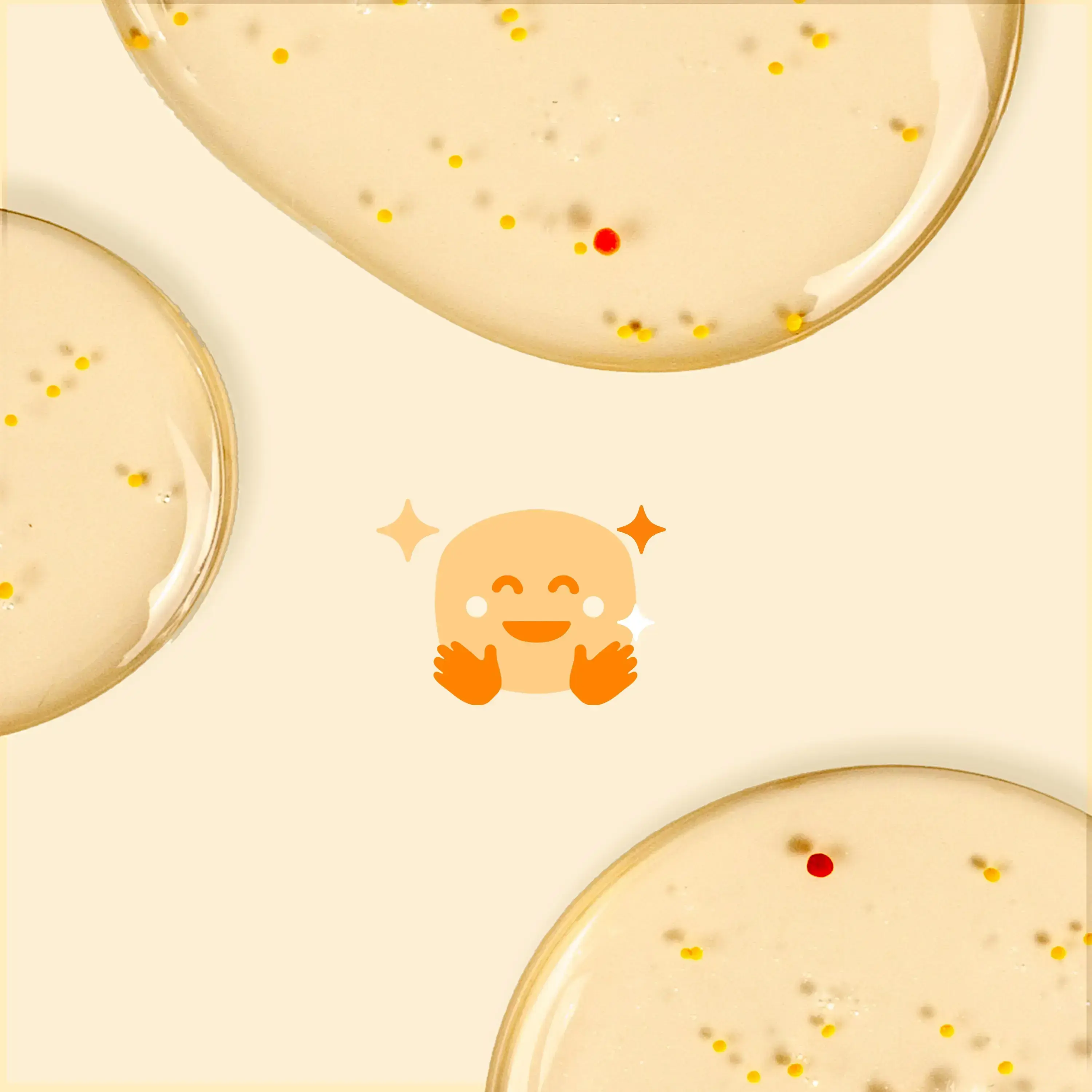 Glossy liquid blobs with tiny colored dots are scattered on a pale background. A happy emoji with sparkles is centered, adding a playful element.