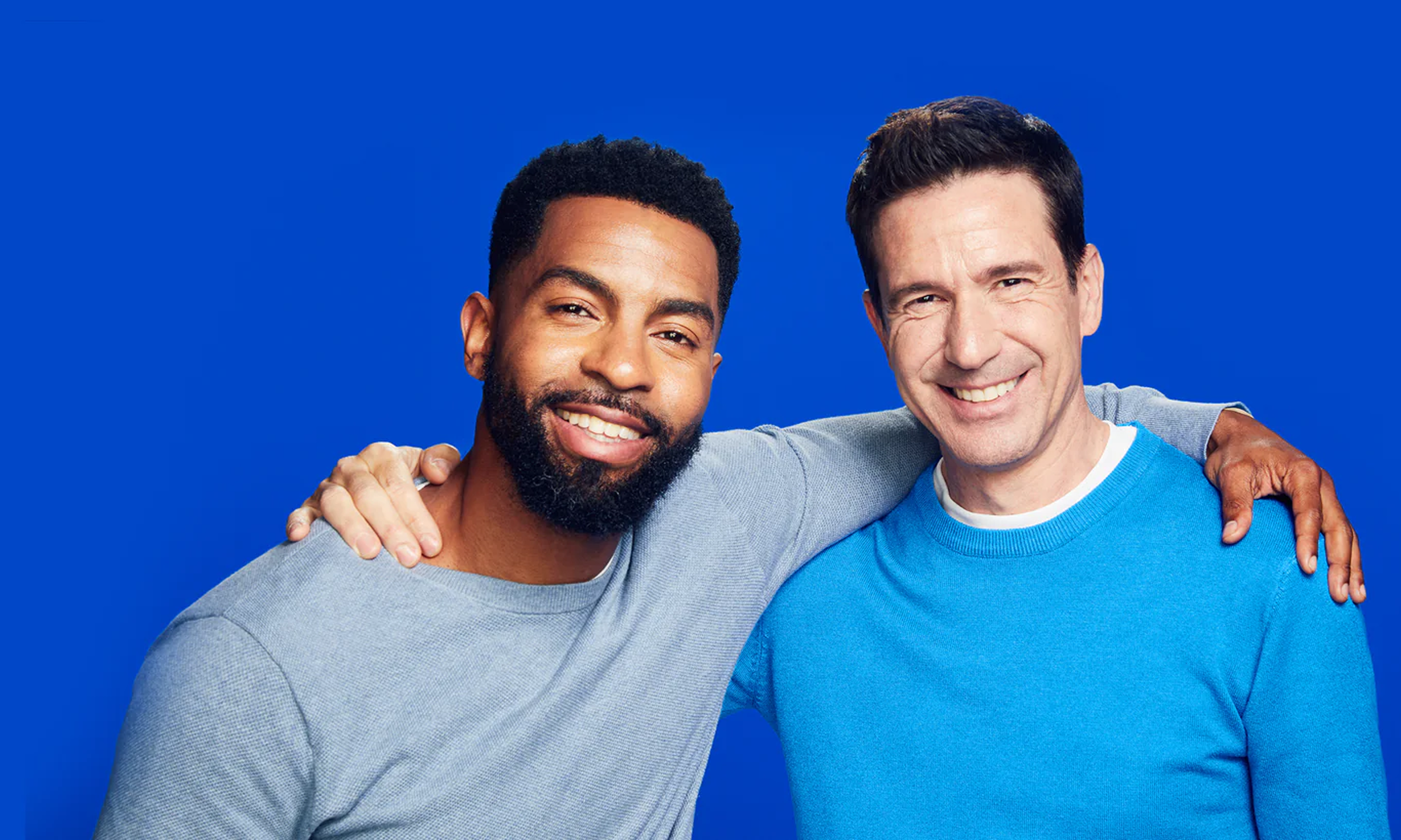 Two men wearing light blue sweaters on a blue background. Text indicating that you can unlock 15% off when you take a quick rogaine quiz to discover the right formula for you.