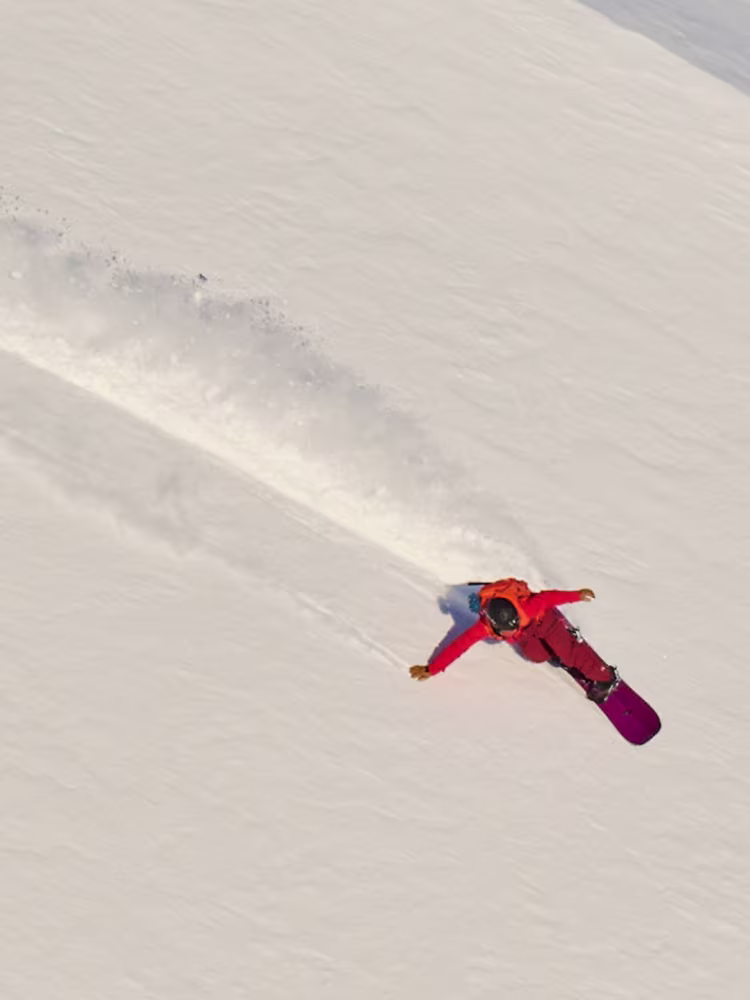 Ayumi Kitahara snowboarding in Haglöfs outdoor clothes.