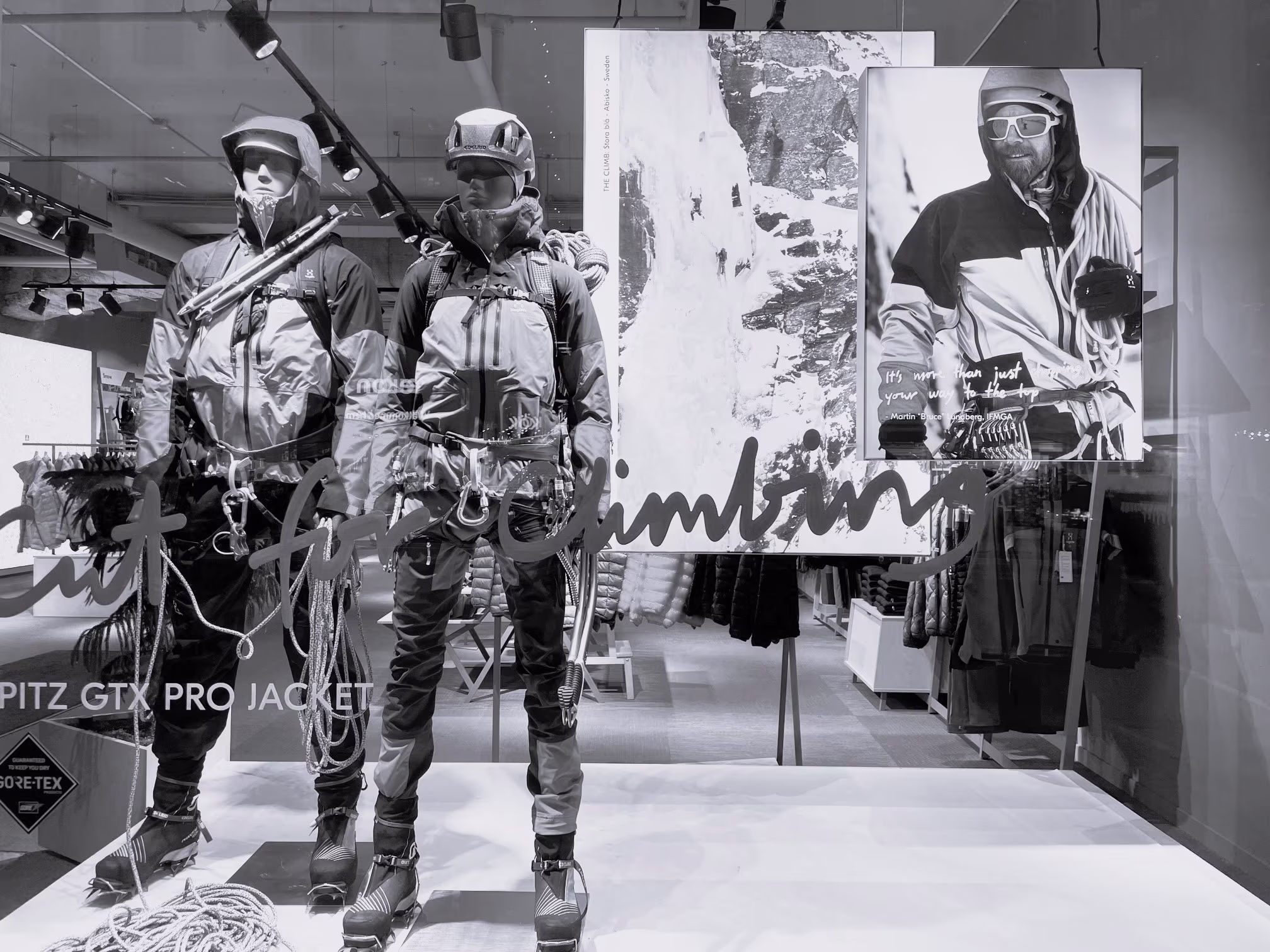 Store window with two mannequins wearing Haglöfs clothing.