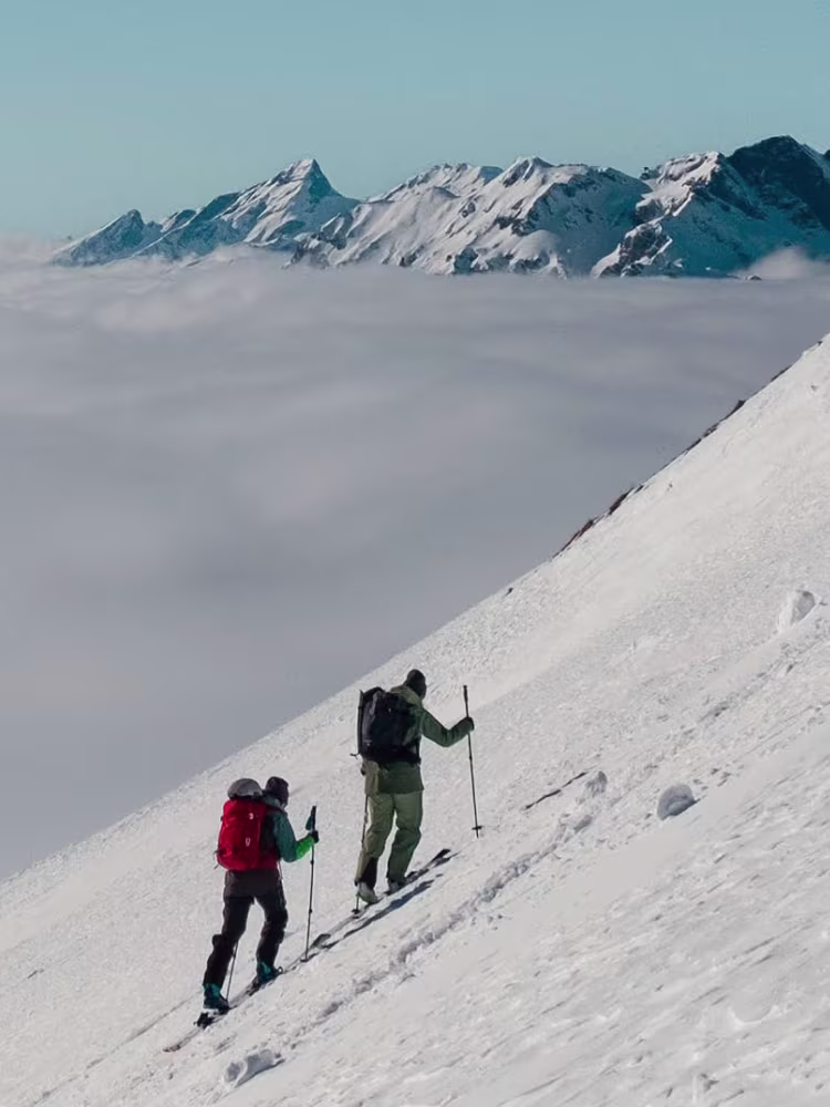 Hiking up a snow-covered mountain