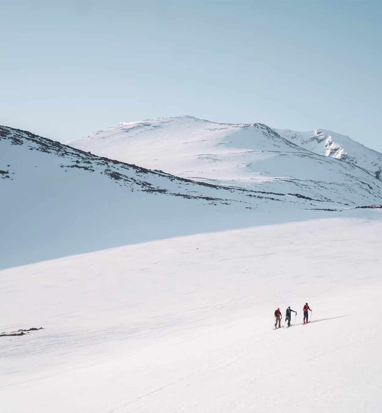Two people touring in a mountain environment