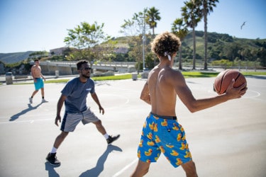 two guys playing basketball