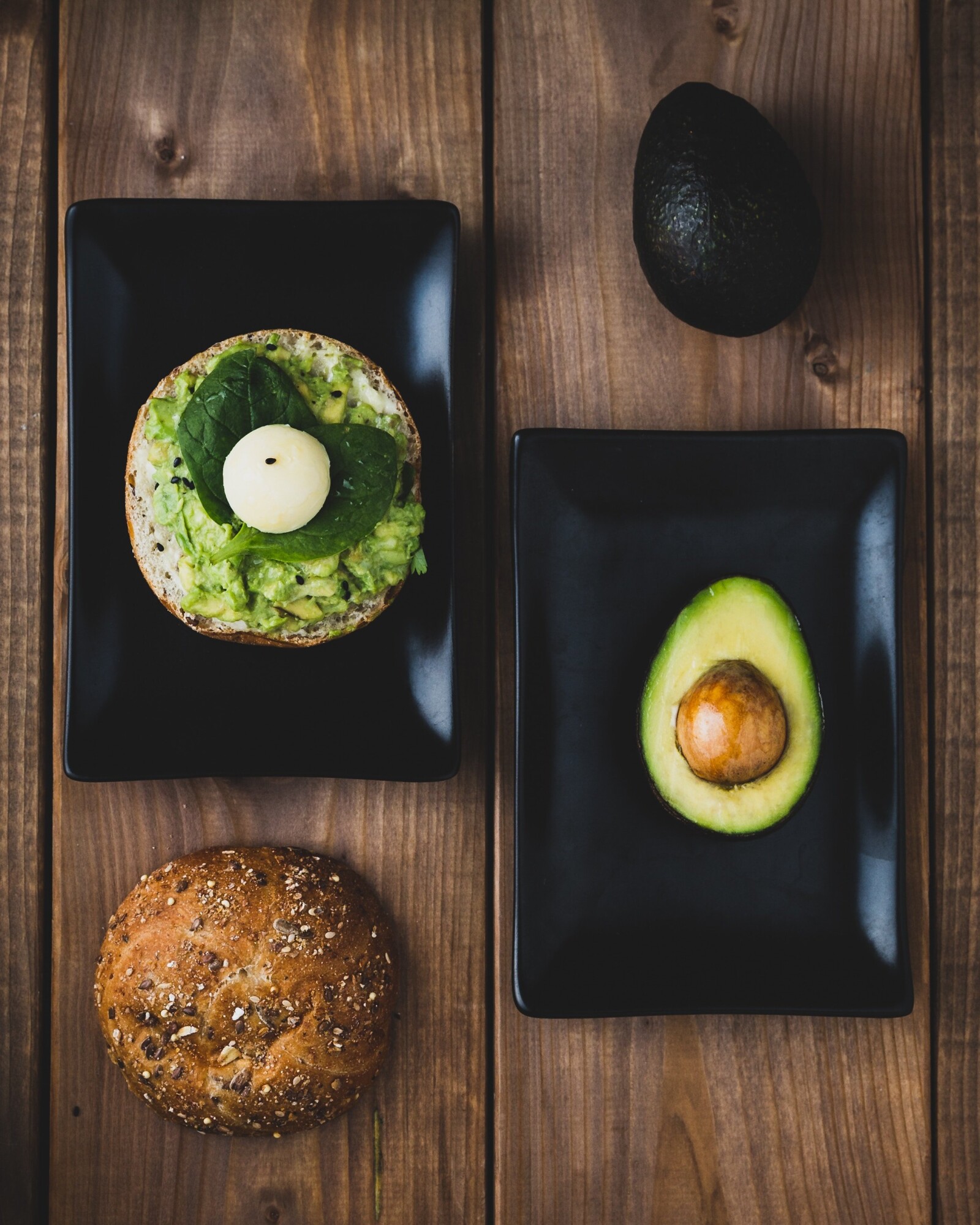 avocado and bread on plates