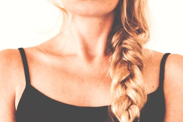 a photo of a woman's chin and shoulders
