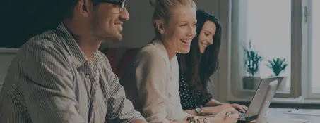 A group of business people sitting around a table