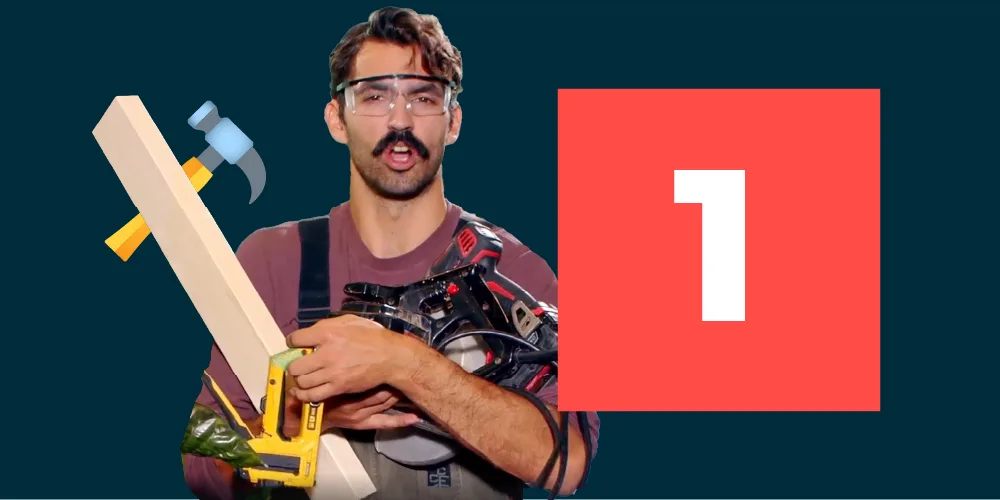 Man holding tools and wearing safety goggles next to the number one