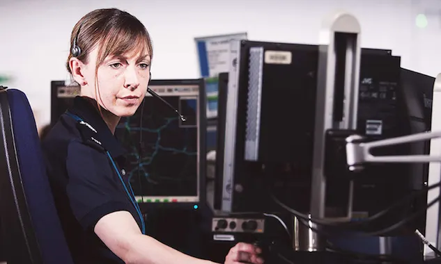 Highways England control center female operator looking at her screen