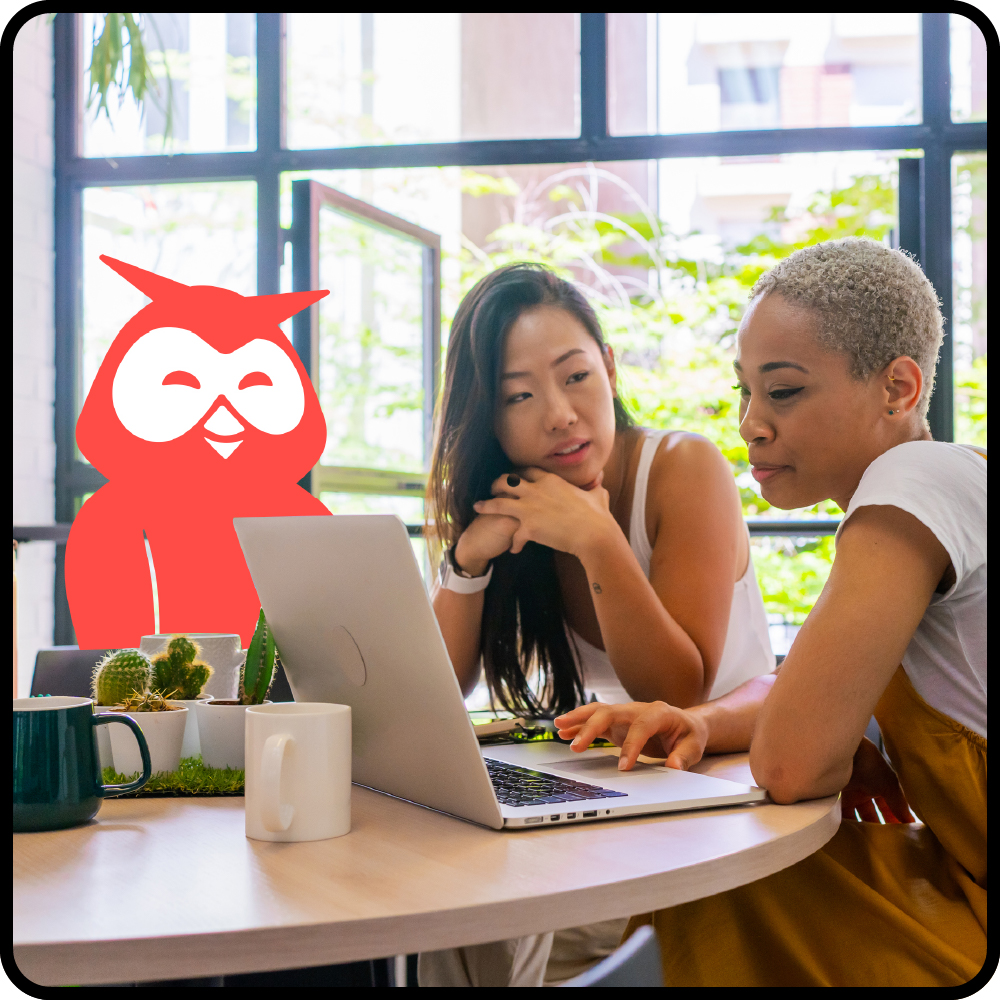 Image of Owly working with two people at a desk