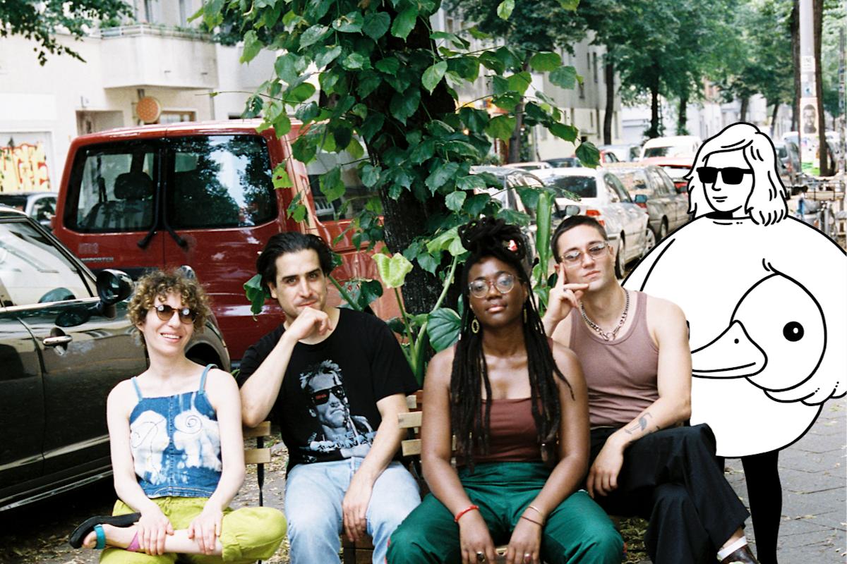 The four breakfast show hosts sit on  weserstraße alongside a minor figures cartoon character.