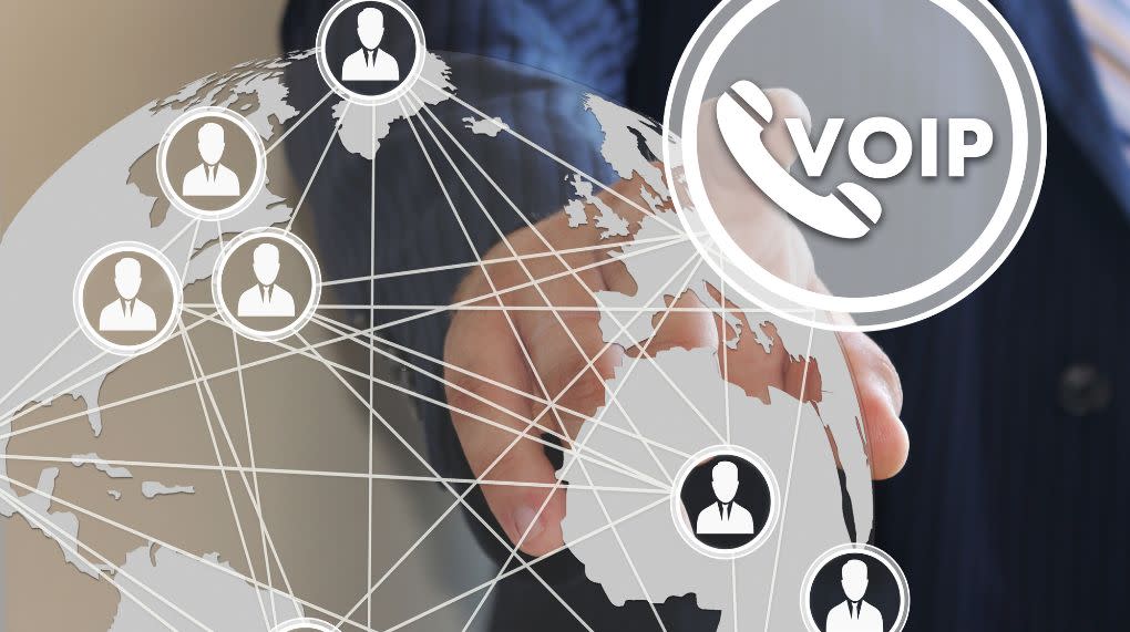 global voip image of hand, phone, globally-connected network