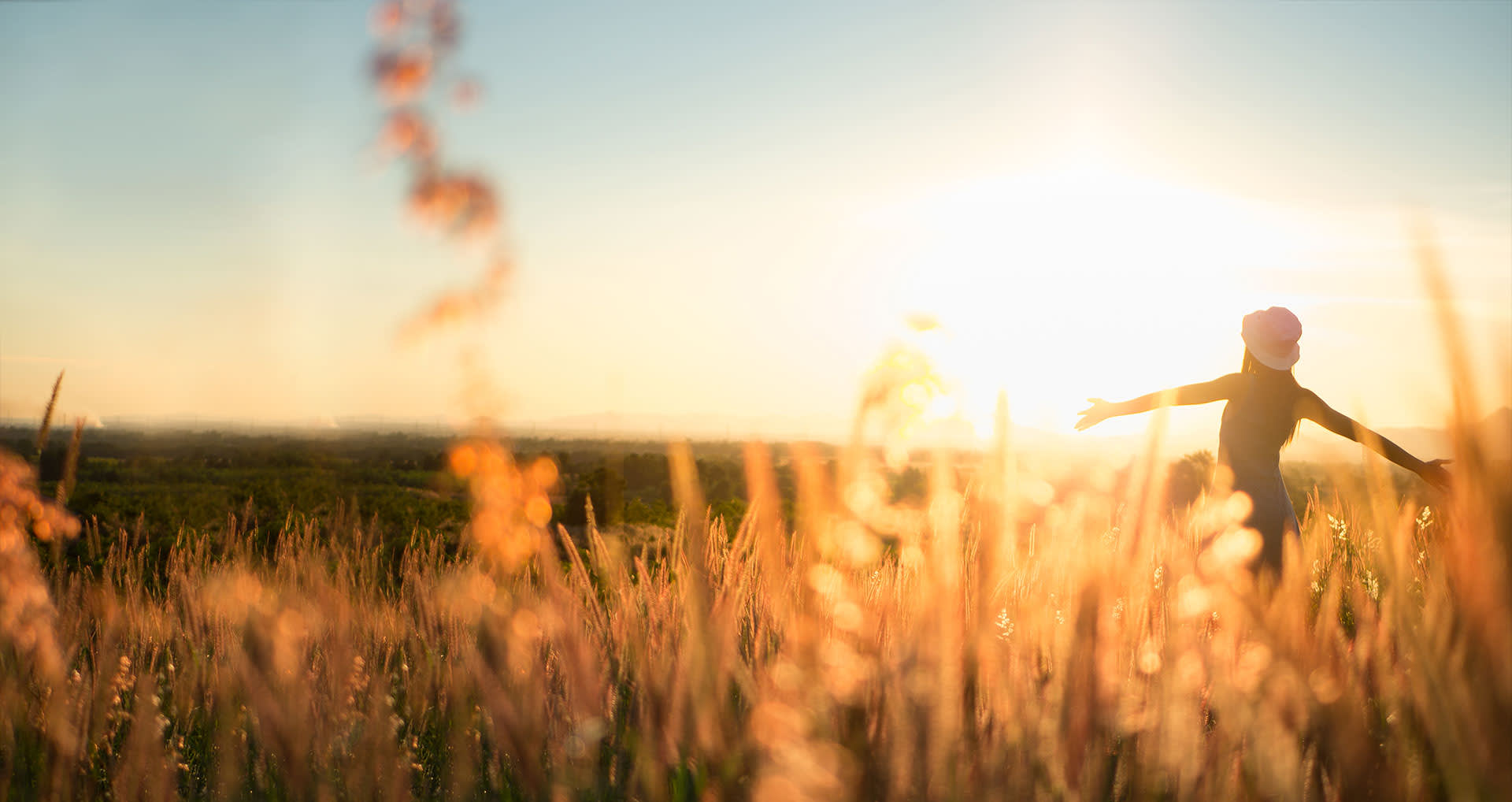 woman-running-happily-in-a-sunny-field-i-screen