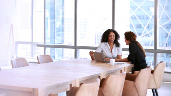 Image of two women having a casual meeting at work