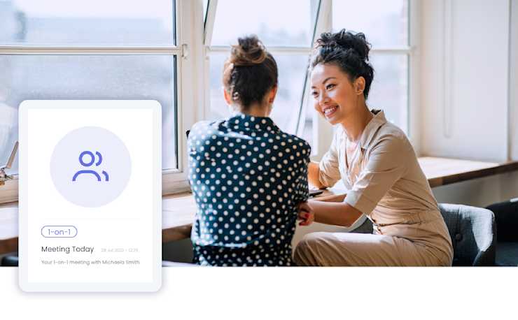 Image of two women having a casual one-on-one meeting at work