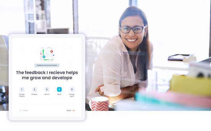 A content and happy new employee with a screen shot of the Eletive app on the question of feedback and communication