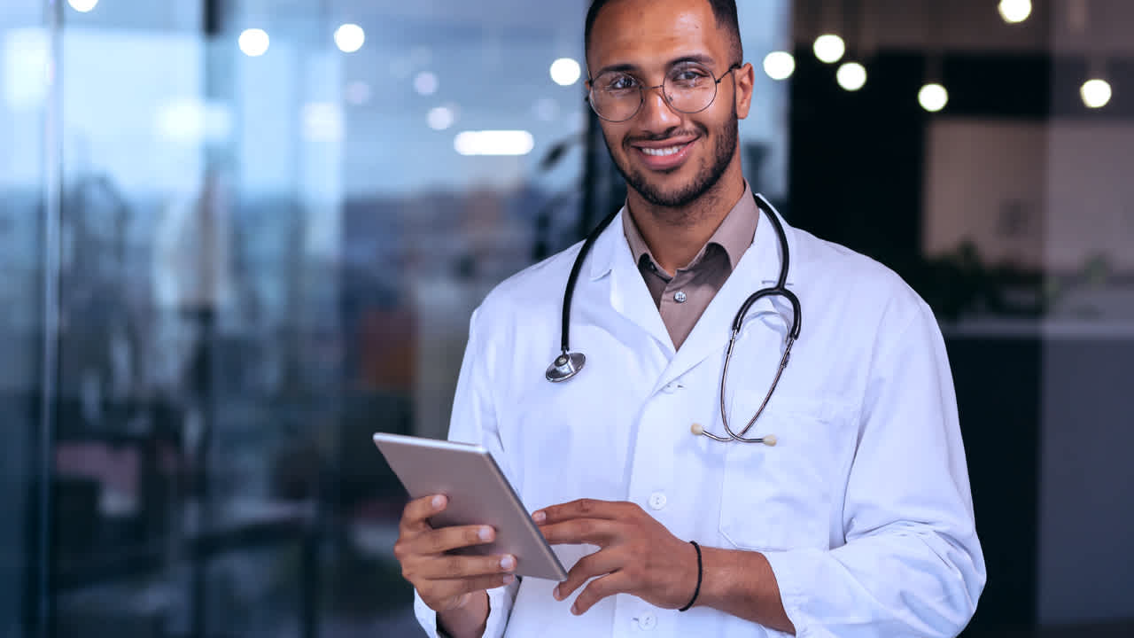 Image of health care professional with a tablet in his hand