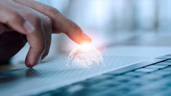 Image of globe on top of computer keyboard representing global companies and multiple languages