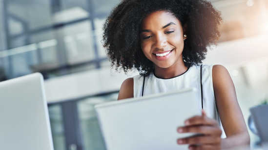 Professional woman using tablet to learn and develop