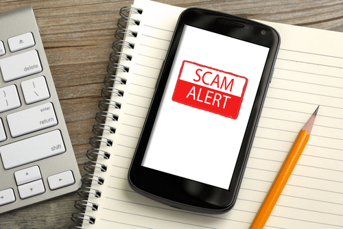 Mobile phone with scam alert warning