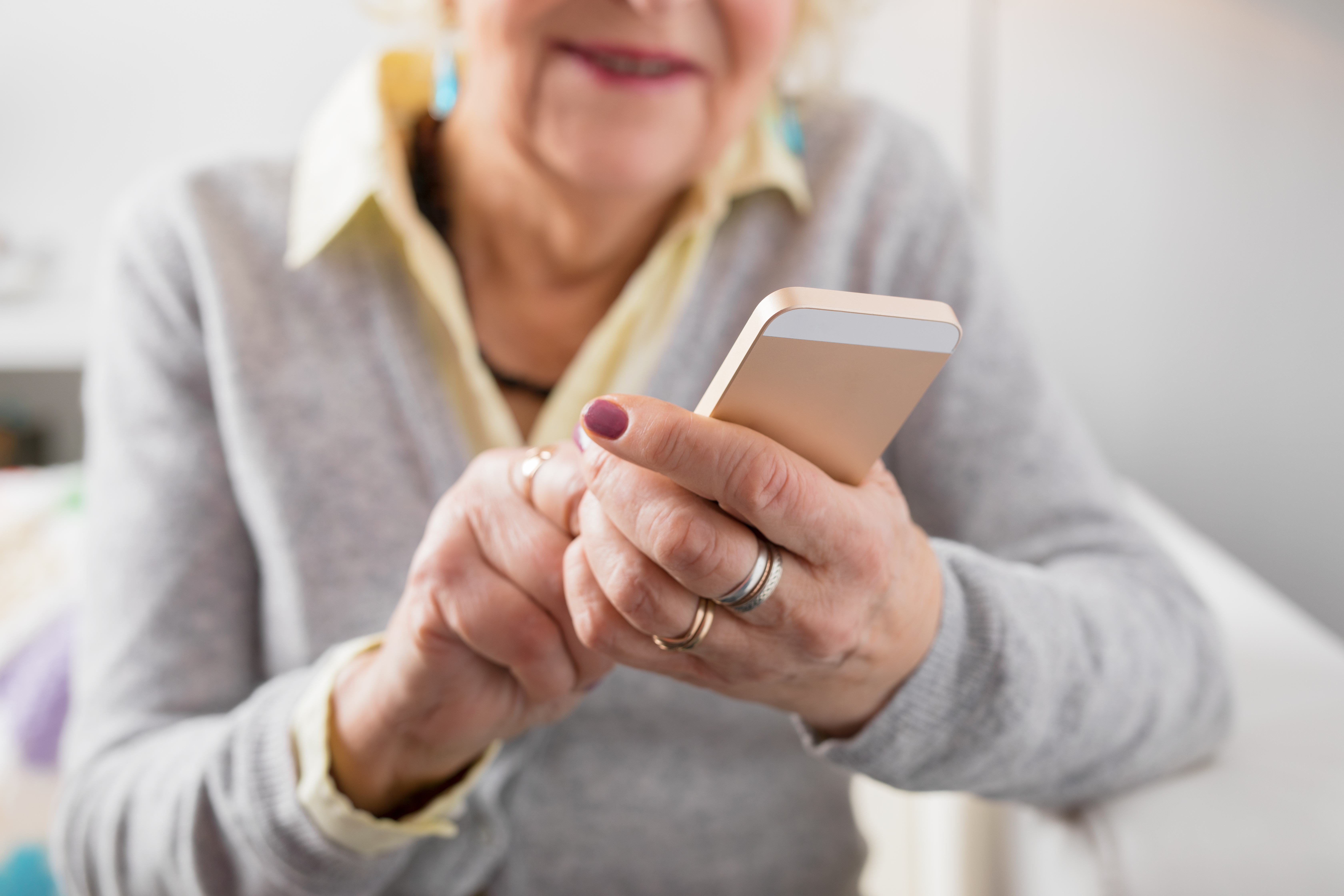 Senior woman holding smartphone